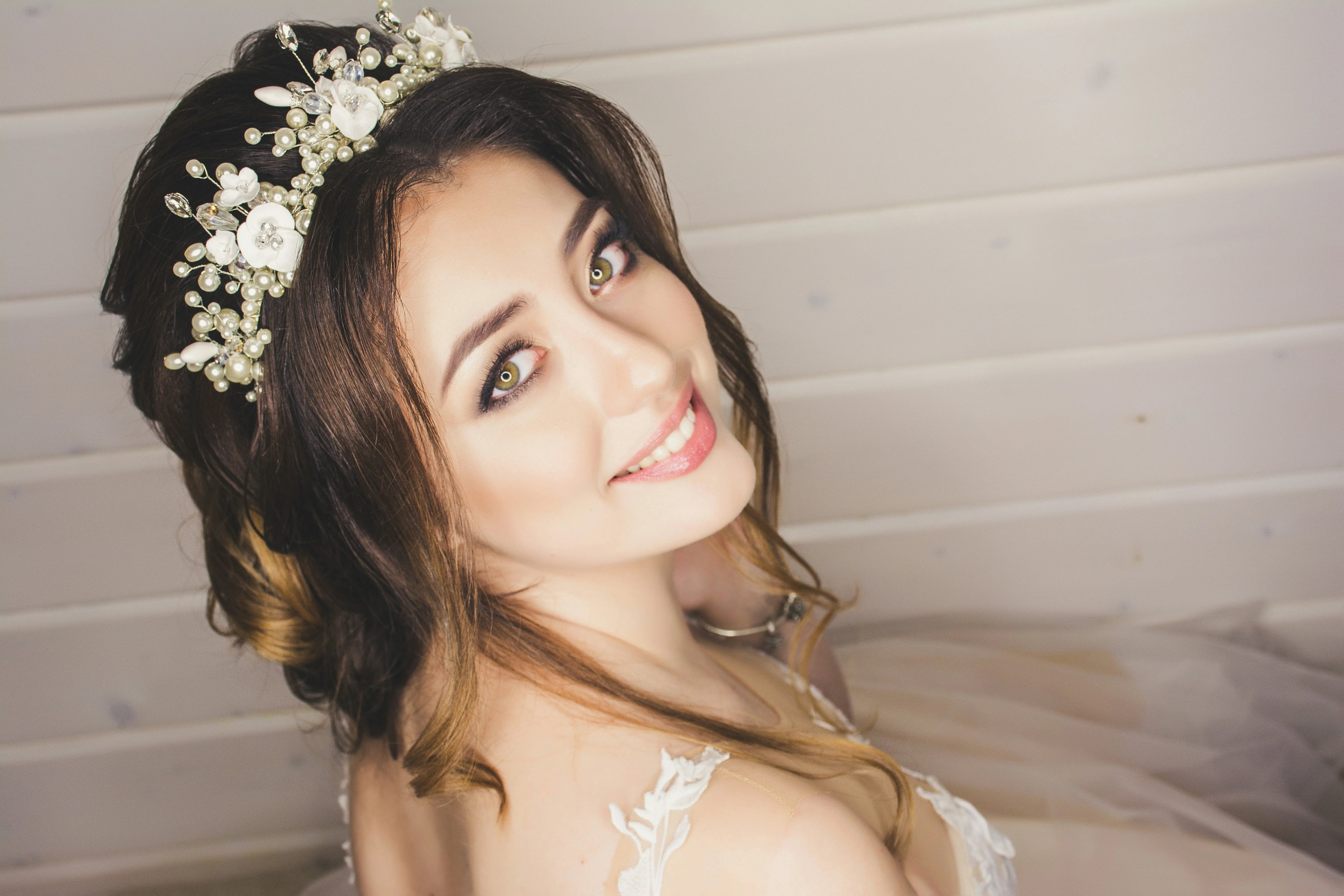 Bride with a soft bridal upstyle and pearl hair vine on her wedding day, styled at Characters Hair Randwick