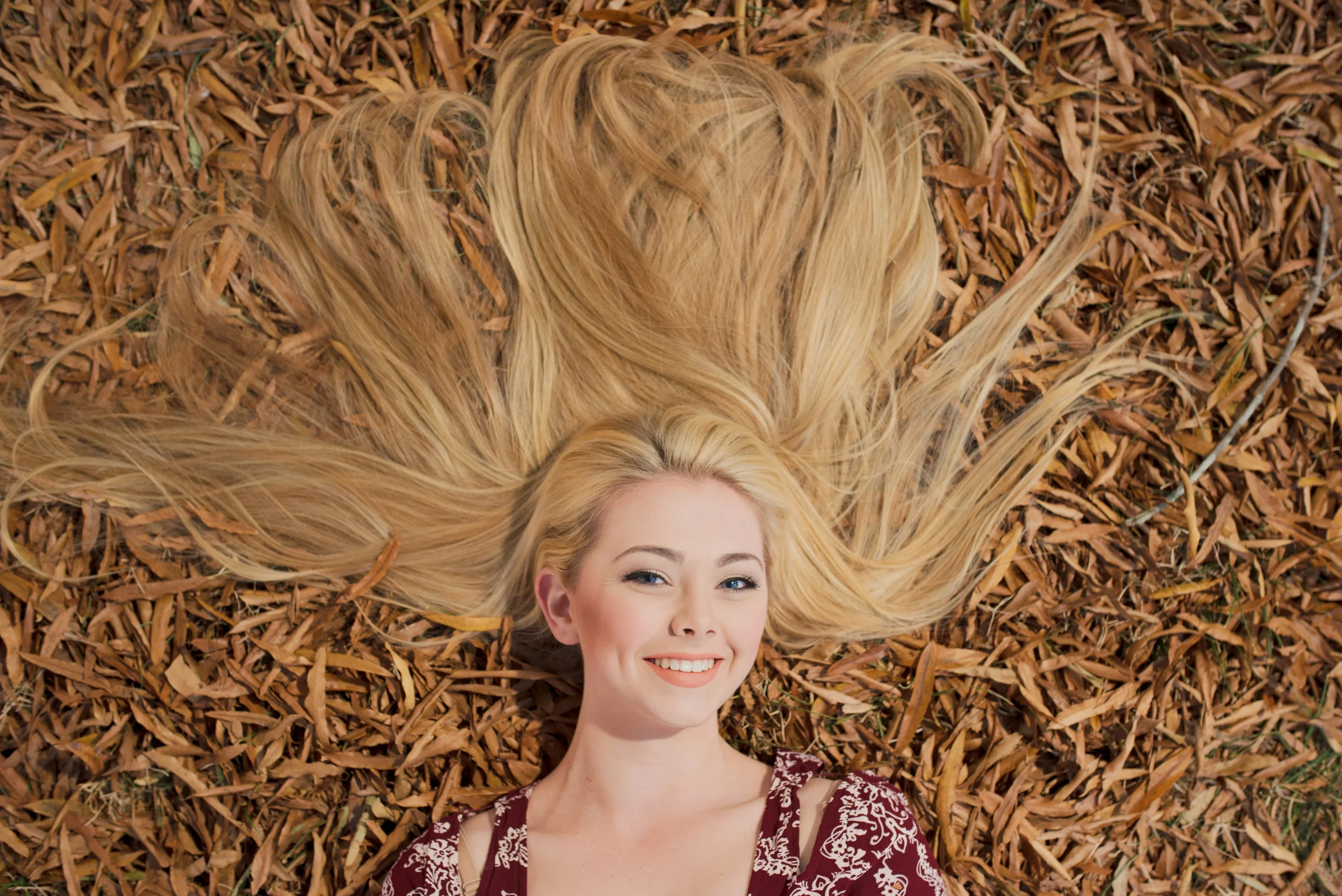 Long golden blonde hair fanned out - blonde transformations at Characters Hair Randwick, Eastern Suburbs Sydney