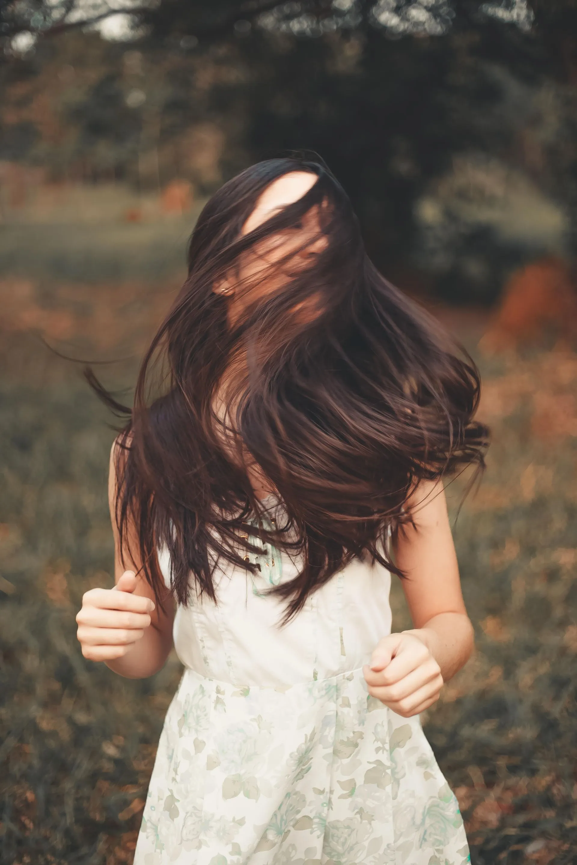Long dark hair falling smooth and frizz-free after a nanoplasty or keratin smoothing treatment at Characters Hair Randwick